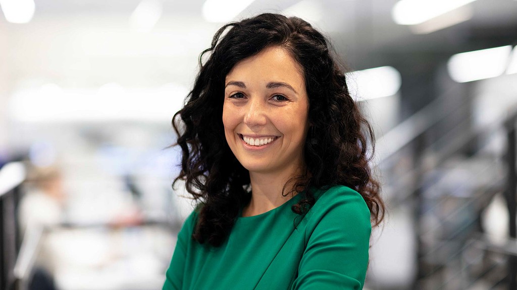 A woman smiling at the camera.